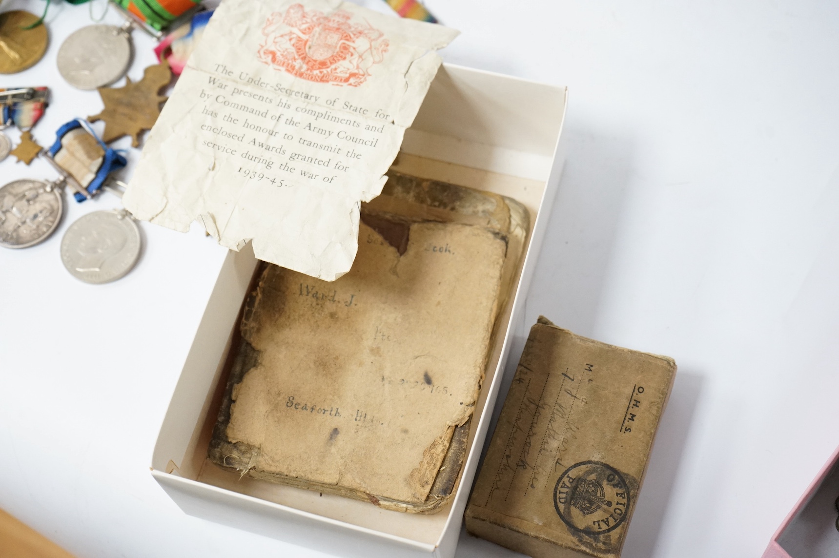 A collection of military medals, shoulder titles, whistles, etc. including; a WWI medal trio to 19698 PTE. T. Campbell. 10-CAN. INF., a miniature trio, four WWII medals; the Burma Star, the 1939-1945 Star, the Defence Me